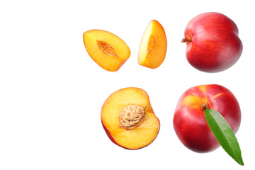 Nectarine with green leaf and slices isolated on white background. top view