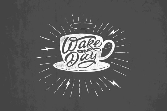 illustration of coffee mug with Wake up Day typography on dark gray background. Vintage lettering on chalkboard. Template for printing on T-shirt, notepad, poster, banner, postcard, sketchbook.