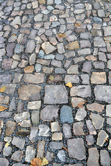 Old pavement of stones of different colors and sizes