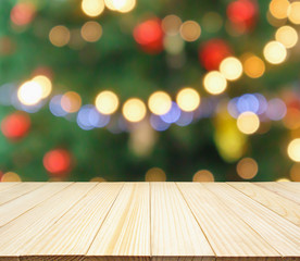 Naklejka na ściany i meble Empty wood table top with Abstract blur Christmas tree with decoration bokeh light background for product display