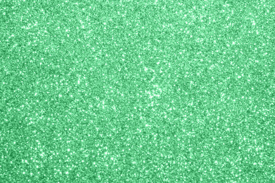 Abstract blur green glitter sparkle defocused bokeh light background