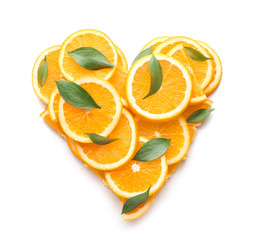 Heart shape made of orange slices on white background