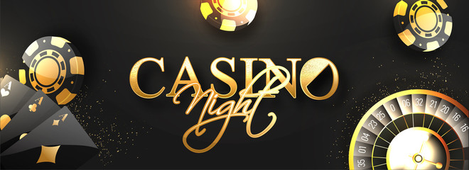 Website header or banner design with golden text Casino Night, roulette wheel, poker chips and playing cards decorated on black background. © Abdul Qaiyoom