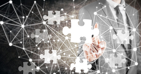 businessman and puzzle on screen