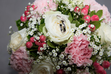 Pair of wedding rings flowers bridal bouquet