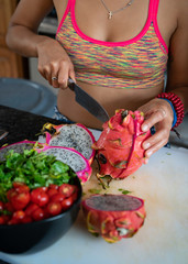 Dragon Fruit Sliced In Seductive Halves with Knife on Cutting Board