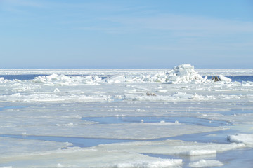 Winter landscape. Pile of ice on a frozen sea.