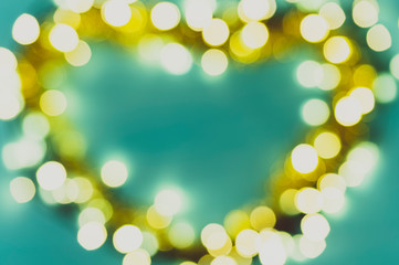 blurred lights in the shape of a heart on a blue background, abstract background image