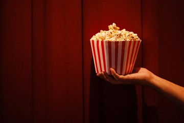 popcorn in front of a red background