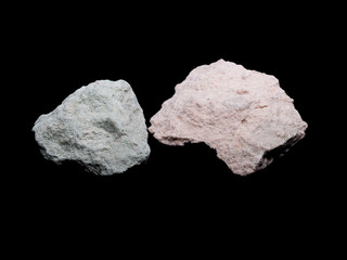 Zeolite natural raw stones on black background. Macro shot