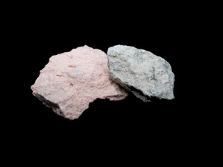 Zeolite natural raw stones on black background. Macro shot