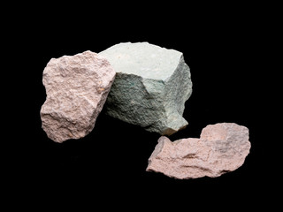 Zeolite natural raw stones on black background. Macro shot