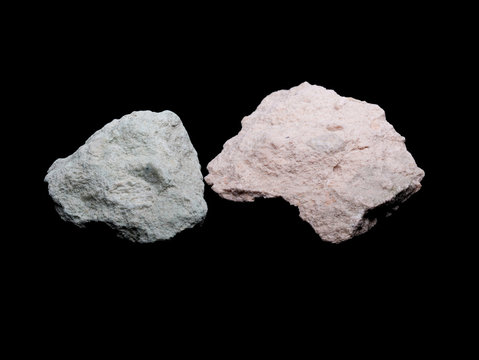 Zeolite natural raw stones on black background. Macro shot