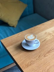 cup of coffee on wooden table