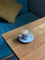 cup of coffee on wooden table