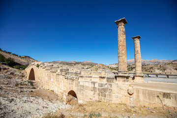 The historical Severan Bridge Adiyaman, which is located on the Cendere River and is considered one...