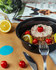 buckwheat and turkey delivery as diet food with lemon, cherry tomatoes