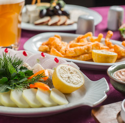 canned fish, lemon, boiled potato, onion, herbs, fried braided cheese plate