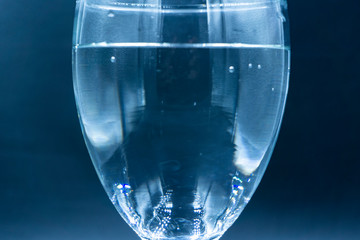 Abstract ink drop to water in glass wine 