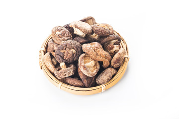 Dried shiitake mushrooms on a white background