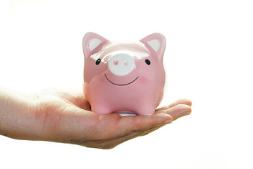 Hand carry pink piggy save money isolated on white background