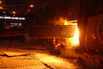 Fototapeta na wymiar Very rare close view of working open hearth furnace at the metallurgical plant