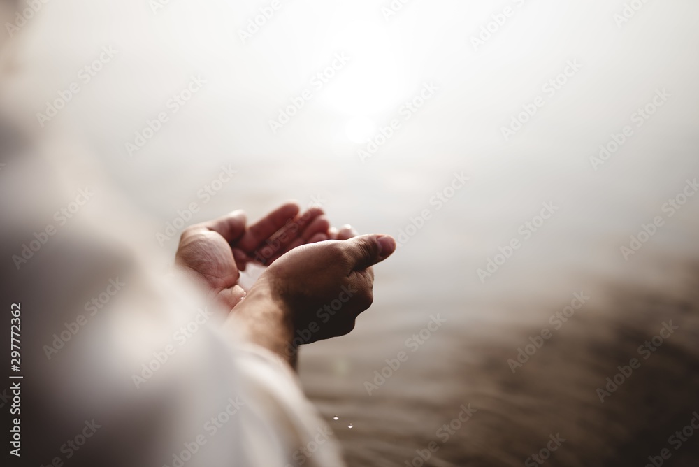 Canvas Prints high angle shot of jesus christ holding water with his palms