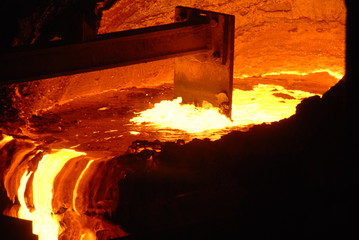 Very rare close view of working open hearth furnace at the metallurgical plant. Molten hot steel
