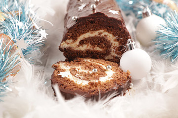 christmas yule log and decoration- festive chocolate pastry with cream