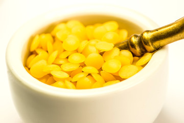 bee wax, closeup of the bee product with cream pot