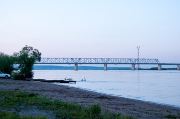 Fototapeta na wymiar Russia, Blagoveshchensk, July 2019: Bridge over the Amur river in Blagoveshchensk