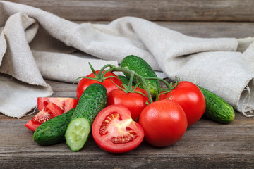 Fresh vegetables on a cutting board on a wooden background