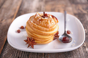 baked apple with syrup and nuts