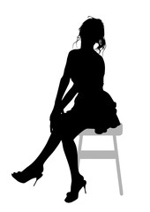 Silhouette of a beautiful young slender girl with long wavy  hair, who sits on a bar stool and holds her arms crossed in her lap.