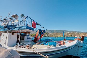 Harbor with leisure and fishing boats at anchor, Paros Island, Greece.