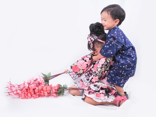 asian little girl and boy playing  Wearing yukata on white backgound