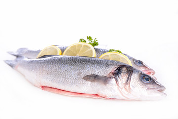 raw fish and lemon isolated on white background