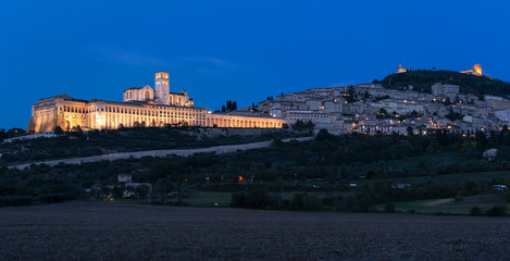 Panoramic landscape. Assisi Basilica of St. Francis at sunset. Night amazing view - 297780352