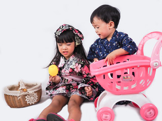 asian little girl and baby boy  Wearing yukata with fruit cart on white backgound