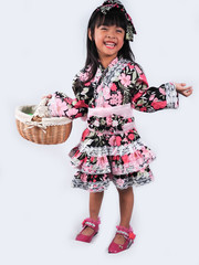 asian little girl  Wearing yukata with fruit basket on white backgound