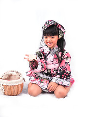 asian little girl  Wearing yukata with fruit basket on white backgound