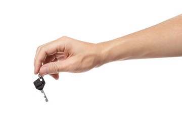 Hand holding a key, isolated on white background