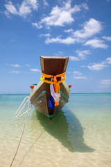 Long tail fishing boat at the beach at the north part of Koh Phangan Island, Thailand,