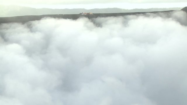 Toxic Gas Swirls Around Crater Of Erupting Volcano