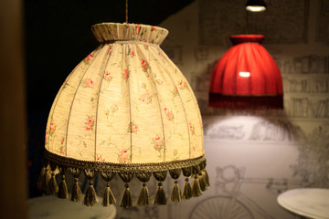Vintage yellow and red lampshades from the ceiling. Interior of a cafe, restaurant or living room