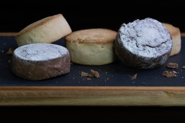 polvorones on a dark wooden table . Typical Spanish sweet dessert. Christmas Holidays.