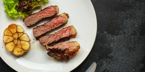 beef steak fried grill (delicious meat, sliced ​​portion serving, roast rare) menu concept. food background. copy space. Top view