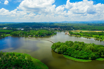 Fototapeta na wymiar Aerial view of natural reservoir with green nature in Chumphon province, Thailand.