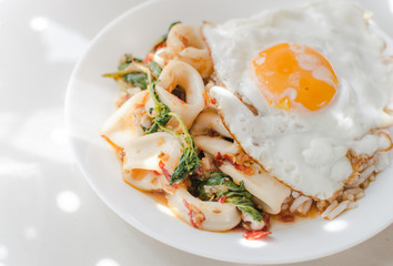 Thai food, Rice topped with stir-fried squid and basil.