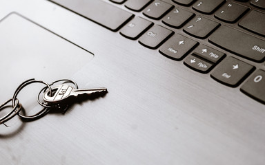 Close up of Still life of Key Ring on laptop computer keyboard. Conceptual image shown as network security key. Cyber Security, protection and privacy concepts.